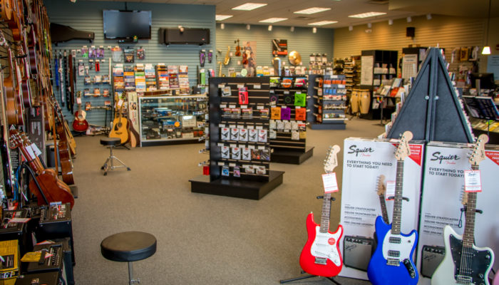 Displays of electric guitars and guitar accessories such as picks.