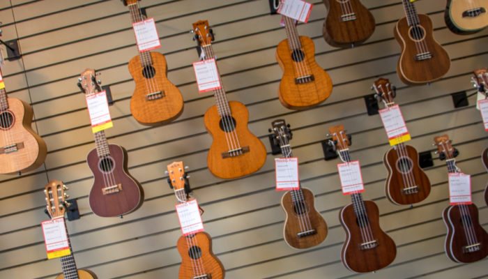 Ukuleles on wall display.