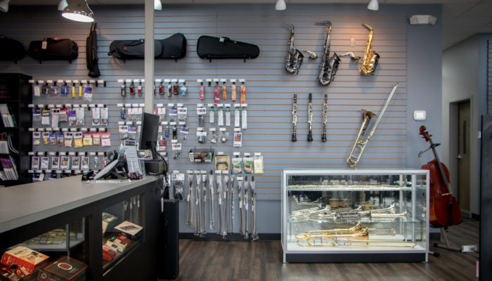 Counter with display of band instruments and band accessories.