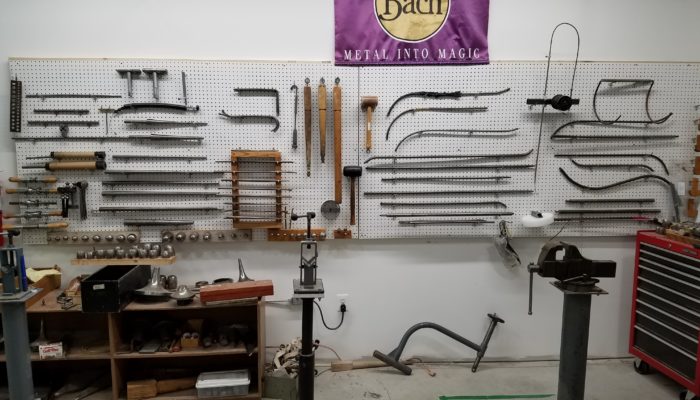 Band repair tools hanging on wall.