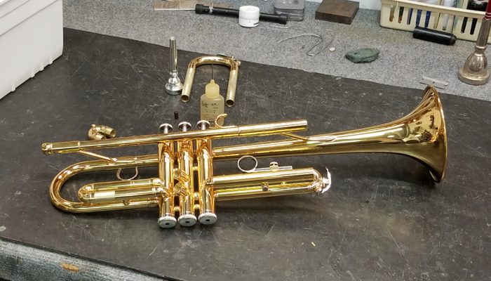 Brass trumpet with it's slides removed for repair and cleaning.