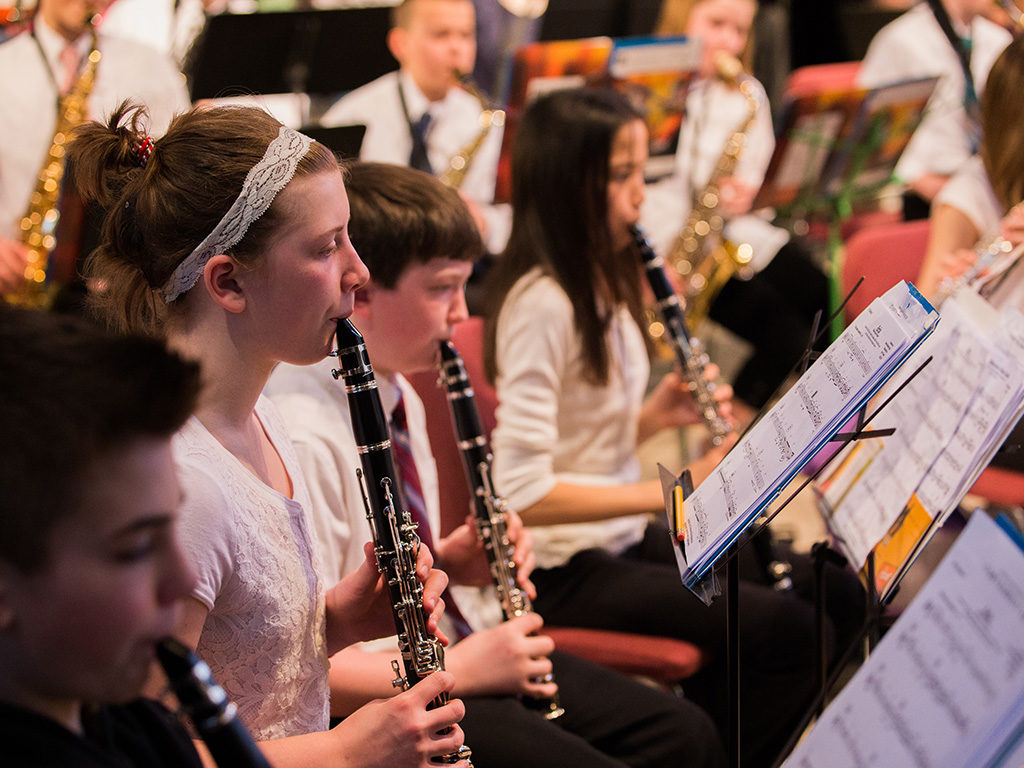 Student musicians playing in a concert band.