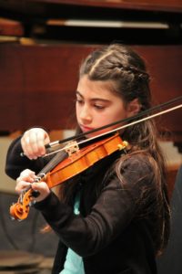 girl playing her easy instrument