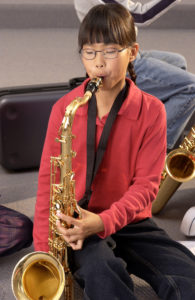 girl playing saxophone