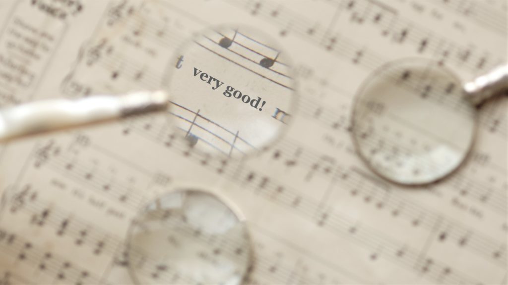 Close up of music notes with magnifying glass