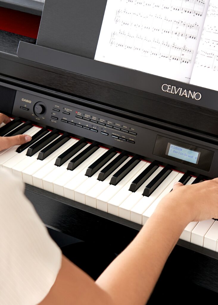 Person playing a Casio AP-710 Celviano