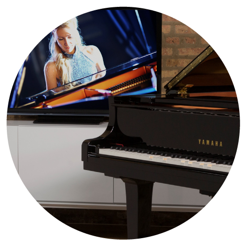 Disklavier Enspire Player Piano with TV playing Disklavier TV