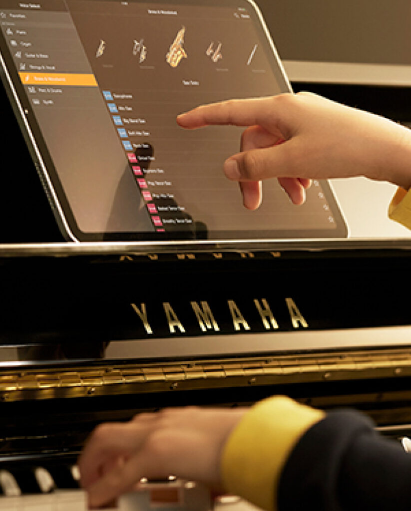 Yamaha SILENT piano with iPad running the Smart Pianist app.