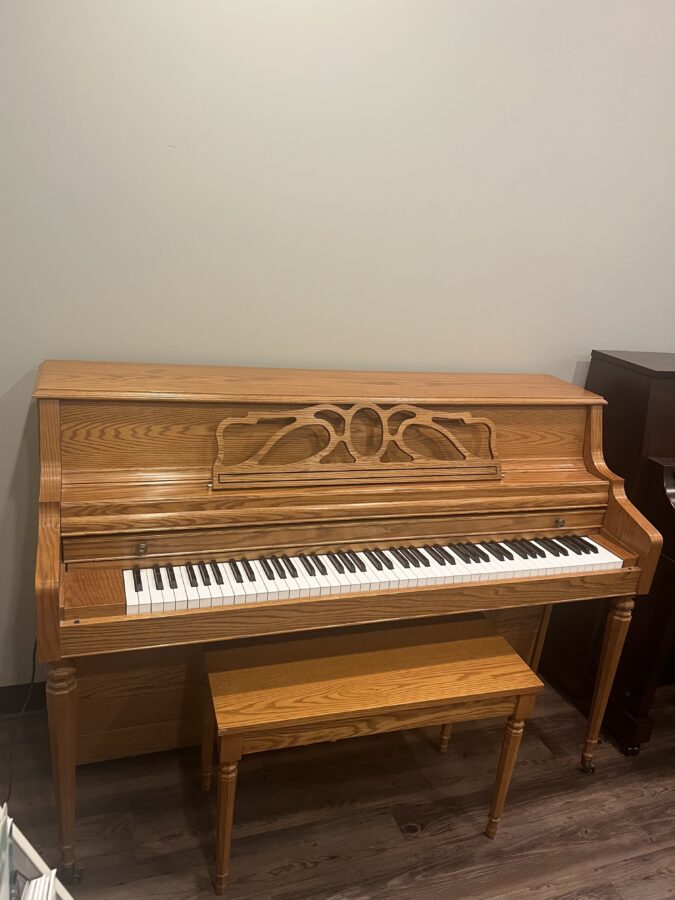 kawai oak 43 inch console piano left side view 1