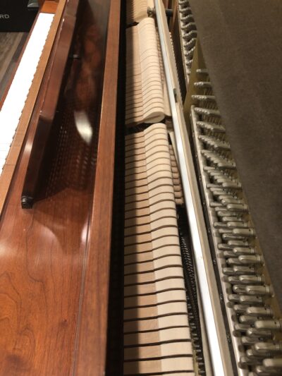 Internal view of a Yamaha M405 upright to show the quality of hammers.