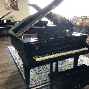 Front view of a fully open Kawai GE1 Polished ebony 5’1” baby grand (1612734).