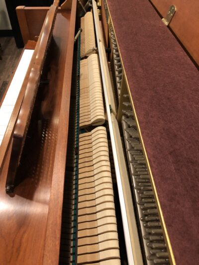 The internal view of the hammers of a Yamaha M405 cherry console piano(#108632)