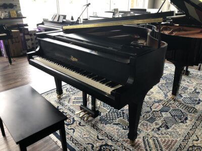 A half open view of a satin ebony Boston GP163II grand piano.