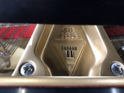 The model and serial number on a Boston GP163II satin ebony grand.