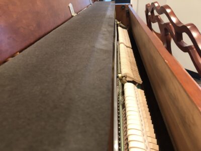 The hammers and inside view of the Yamaha, Model M500P in cherry, #233143 from 1998 with matching bench.