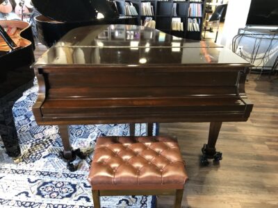 The direct front closed view of the Steinway - Model “M” (brown mahogany) – 5’7” Grand Piano.