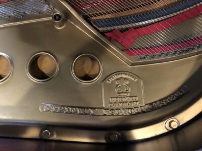 The cast iron of the Steinway - Model “M” (brown mahogany) – 5’7” Grand Piano.