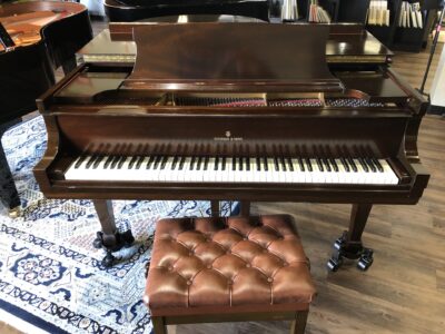 The direct front view of a Steinway - Model “M” (brown mahogany) – 5’7” Grand Piano.