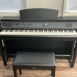 Yamaha CVP605B front view with bench and key cover open