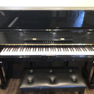The front, open view of the Yamaha U1 in polished ebony with matching bench.
