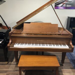 The front view of the Kawai_KG-2C_Satin Walnut_562652 with matching bench.